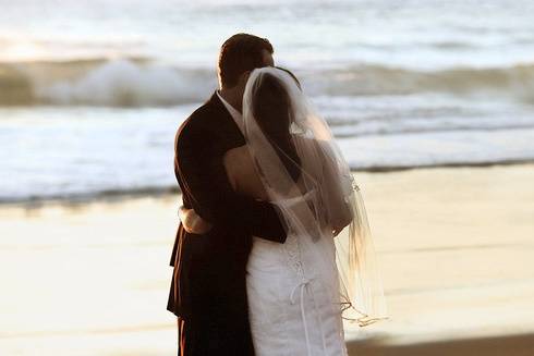Newlyweds by the beach