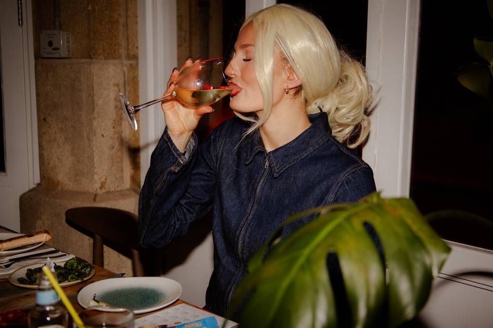 At the table.