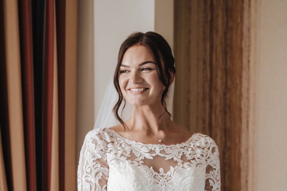 Smiling and holding bouquet