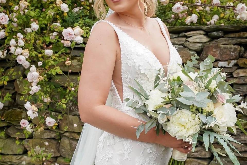 Married and holding bouquet