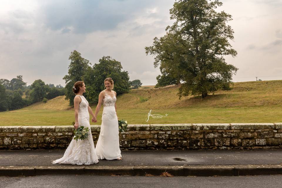 Brides walking along the road