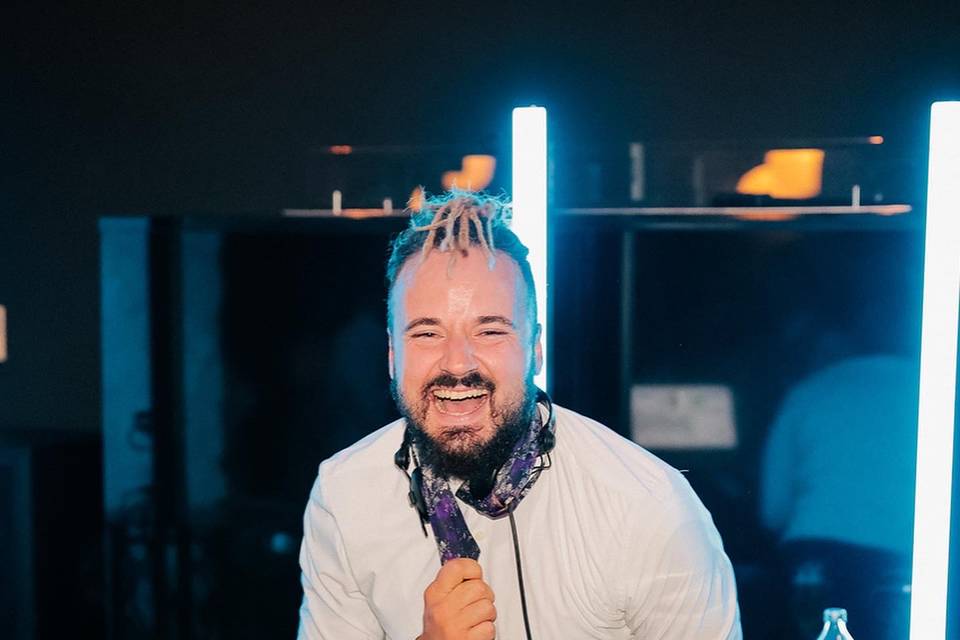 Dj at a wedding smiling