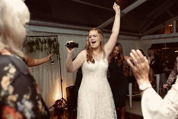 Bride filming the party