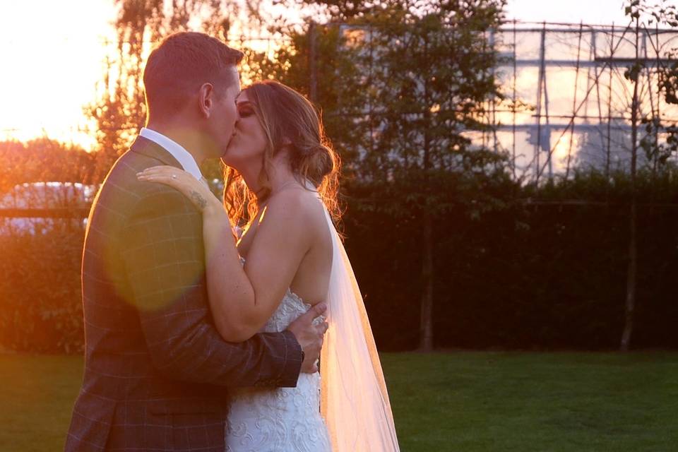 Newlyweds kissing