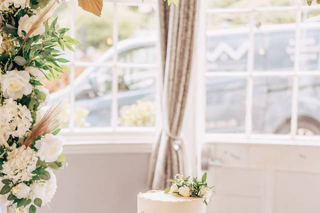 Arch used as cake backdrop