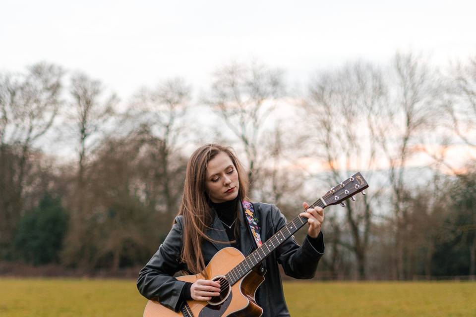 Holding guitar