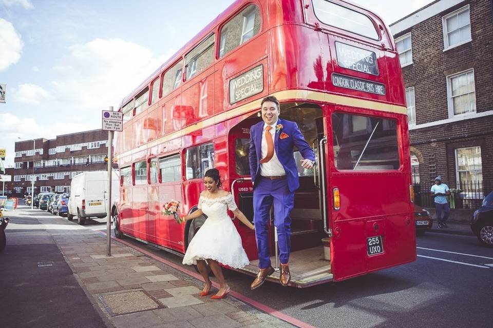 Iconic red bus wedding transport