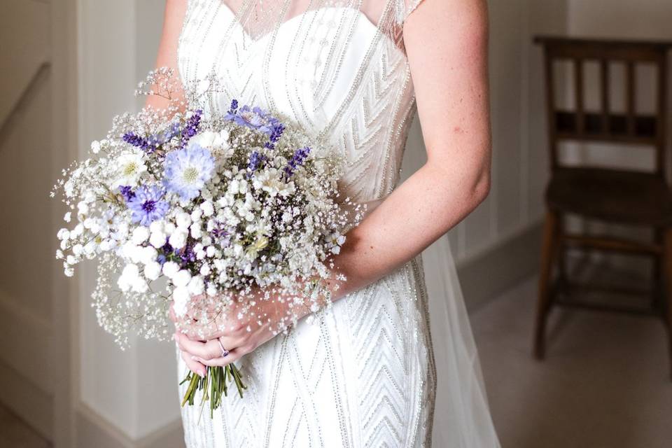 Holding bouquet and smiling