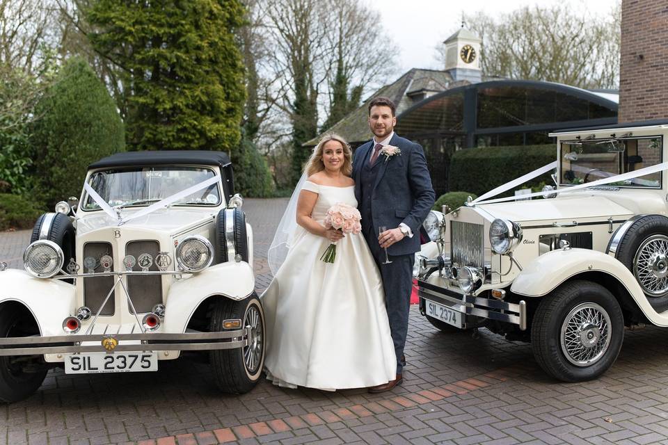 Couple outside courtyard cars