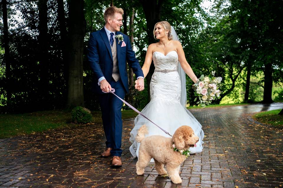 Bride, groom, dog - driveway