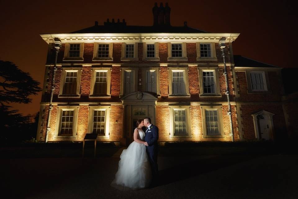 Couple in front of The House