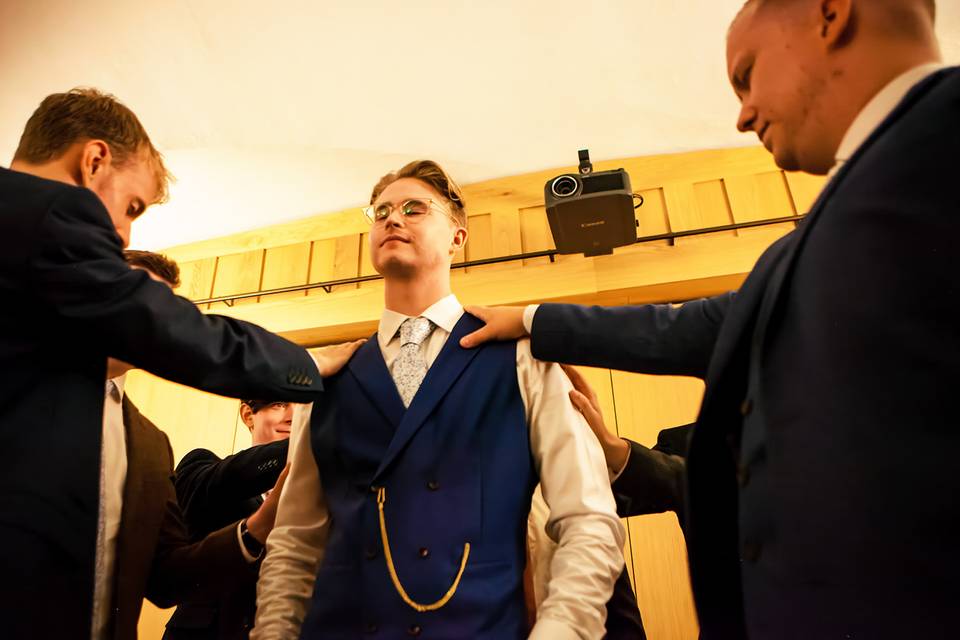 Groom in church praying