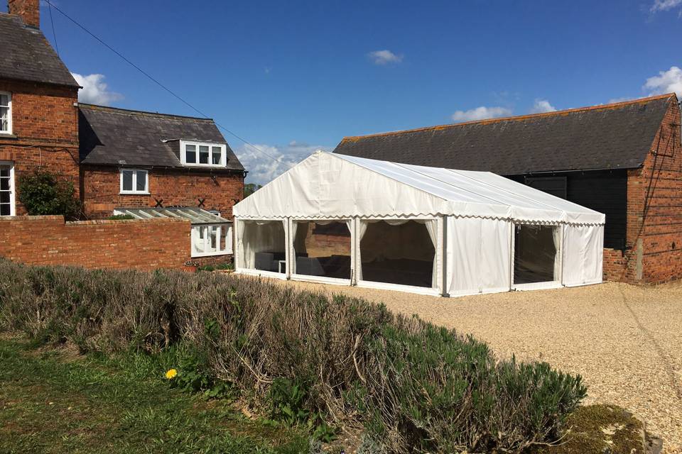 Marquee attached to a barn