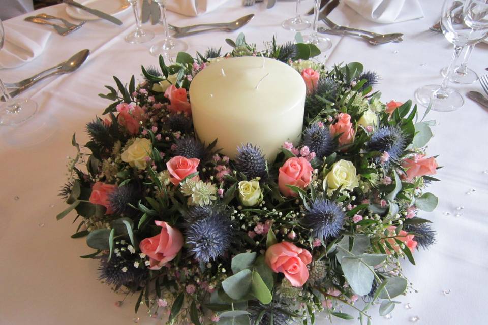Candle with floral surround