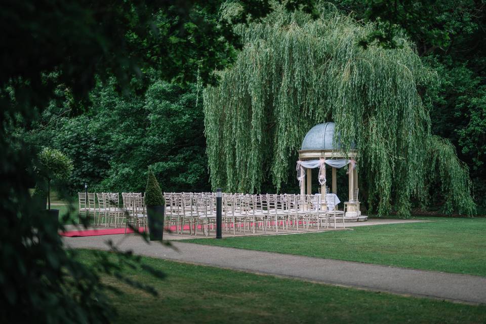 Elegant ceremony area with abundant greenery