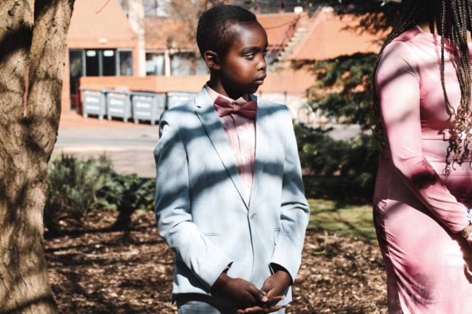 Young boy in grey wedding suit