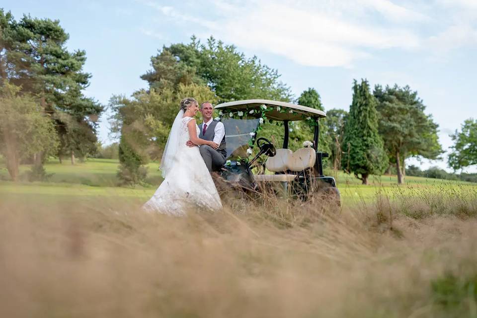 Sitting and standing by the golf cart