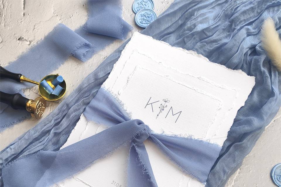 Deckle edge tied with ribbon
