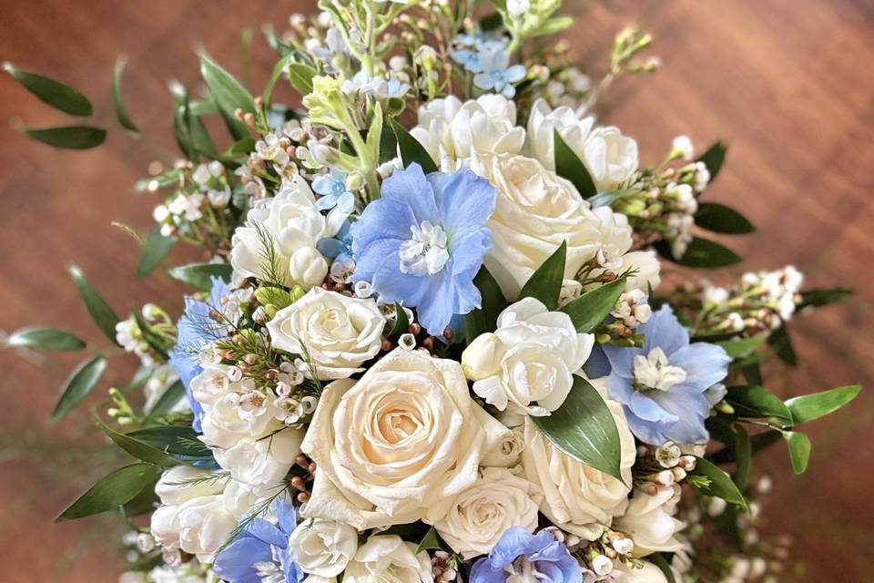 Delphiniums, Rose, Freesias.