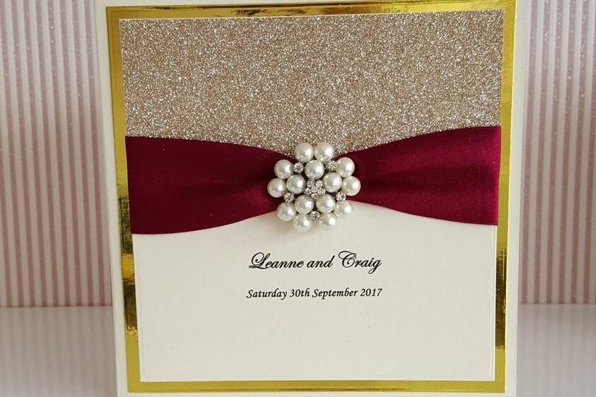 Champagne and maroon invites