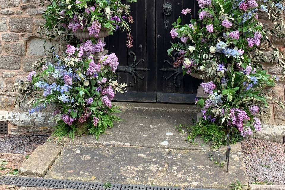 Seasonal broken floral arches