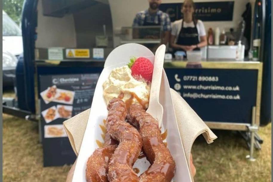 Churros with cream and strawberry