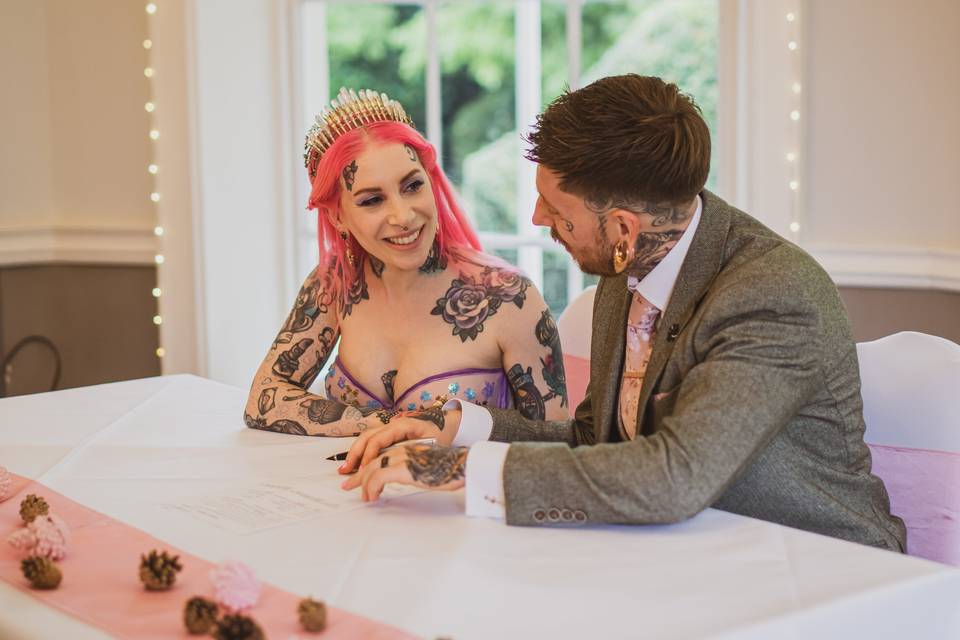 Bride and groom signing