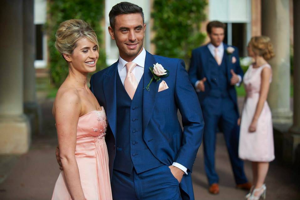 navy suit pink tie wedding