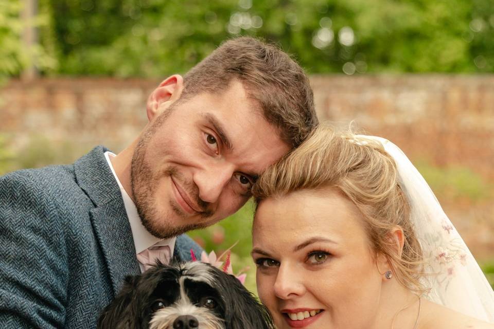 Bride and groom and dog