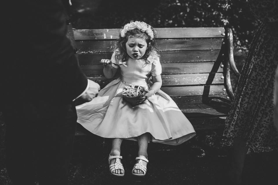 Flower girl eats chips