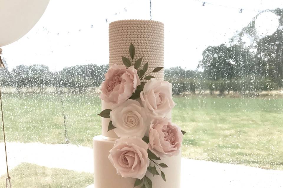 White sugar pearl and shimmer wedding cake