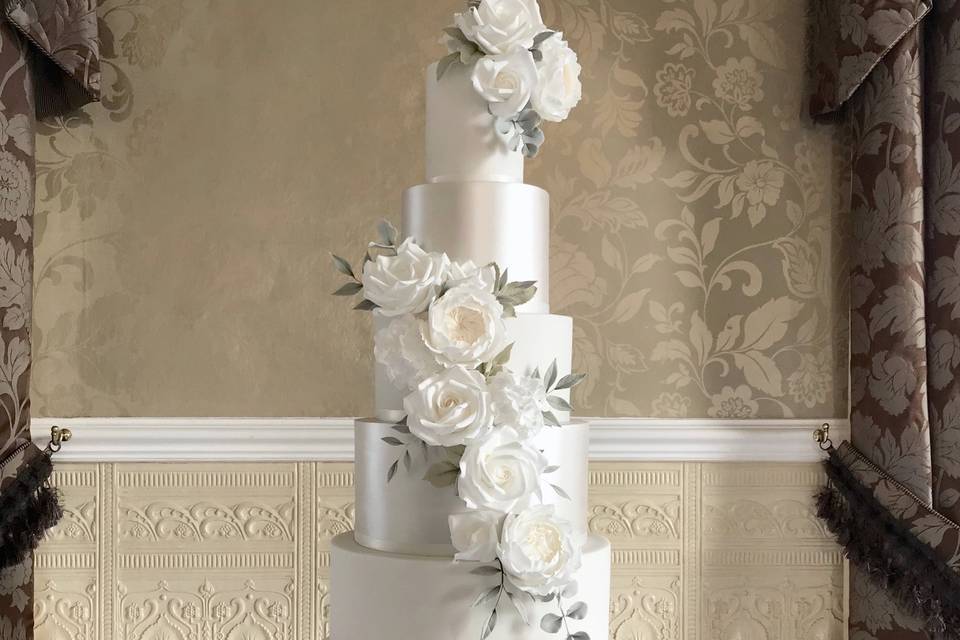 White pearl shimmer floral cascade wedding cake