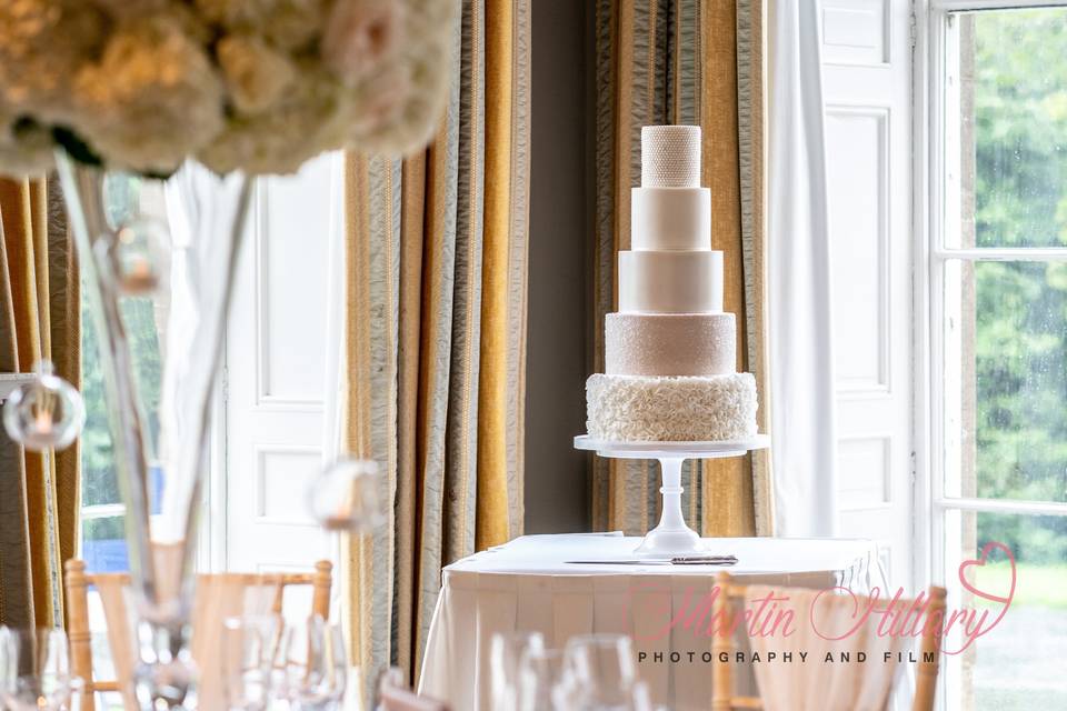 Nude sparkle, ruffles pearl wedding cake