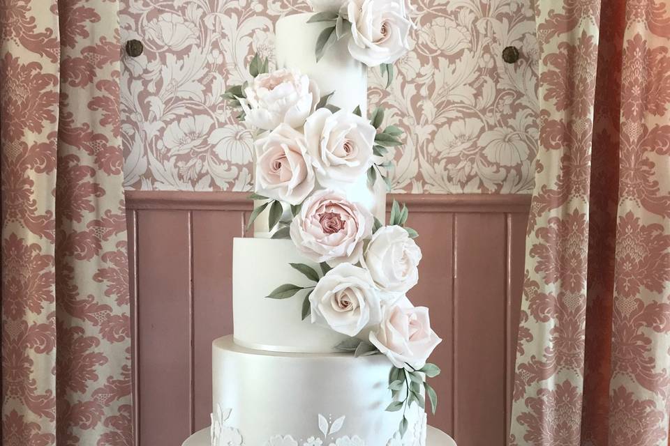 Sugar lace and shimmer floral cascade wedding cake