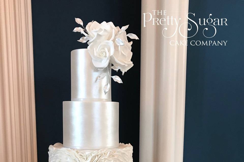 White shimmer and ruffles wedding cake