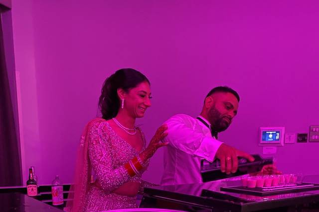 Bride and Groom Pouring the Sh