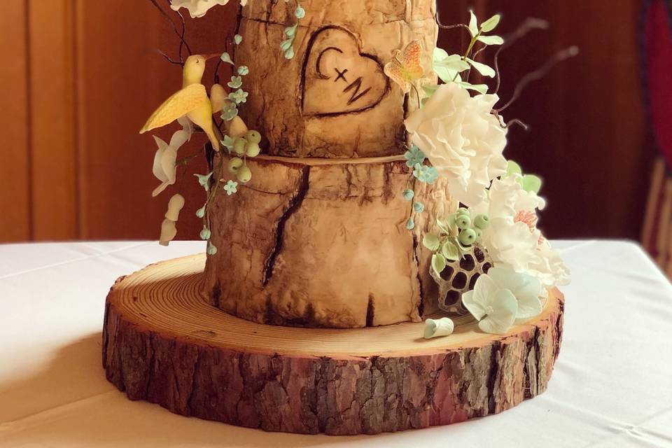 Birch wood and sugar florals on wedding cake