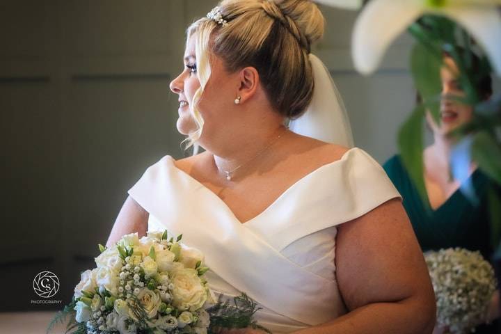 Holding bouquet at the Palm Court Hotel