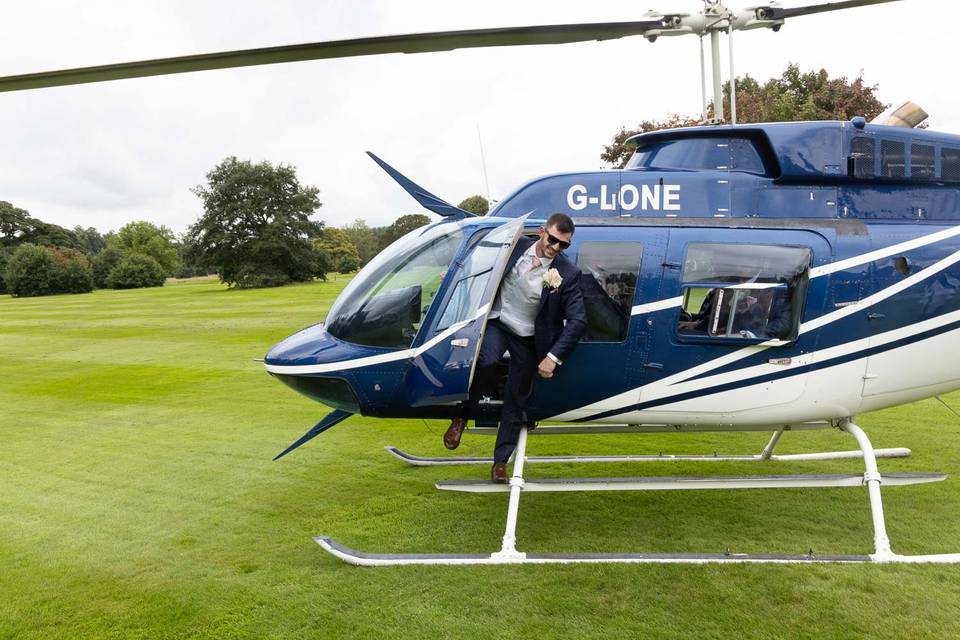 Arrive in a helicopter