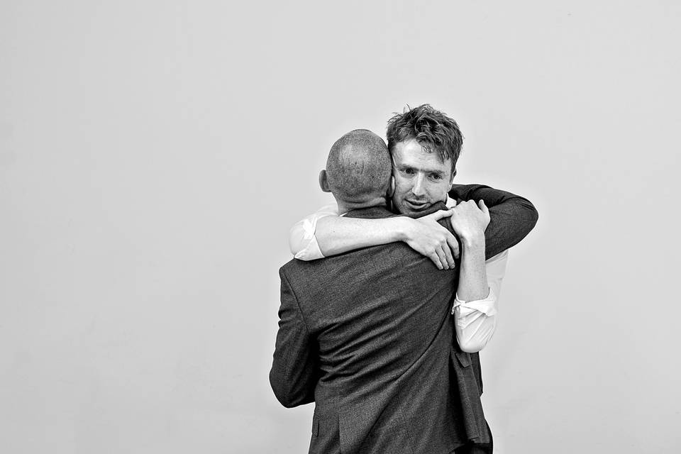 Best man hugs