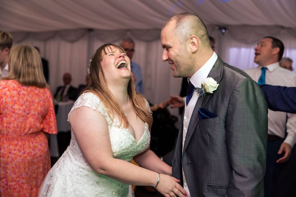 Bride and groom laughing