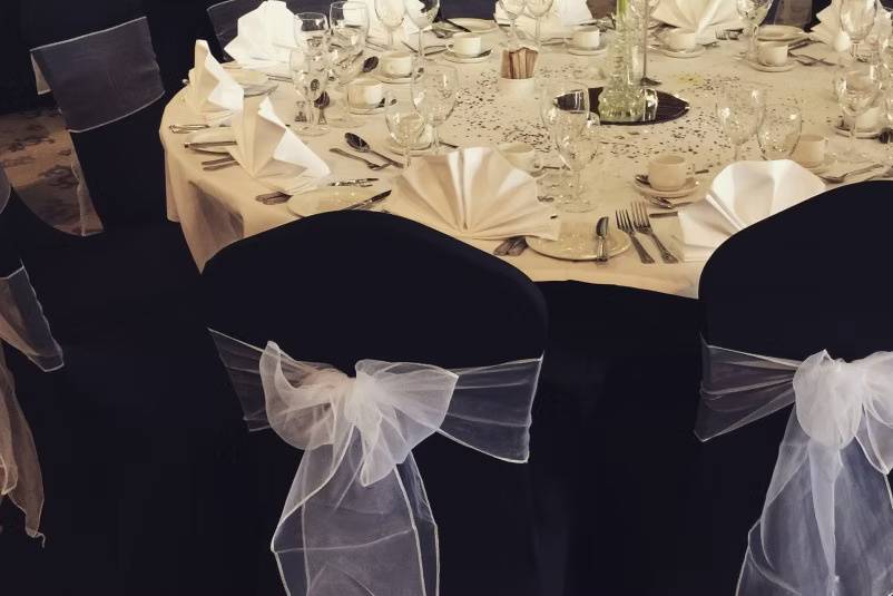 Black chairs and sashes