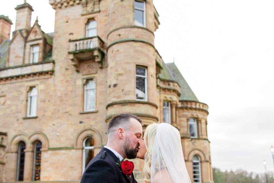 Kissing bride and groom