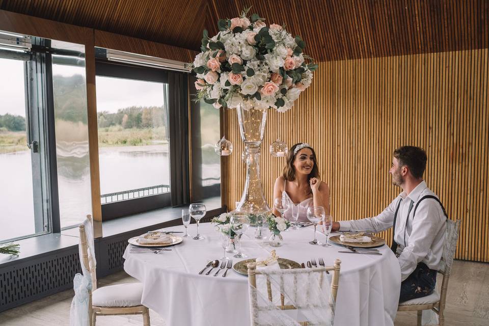 Newlyweds seated at a round table