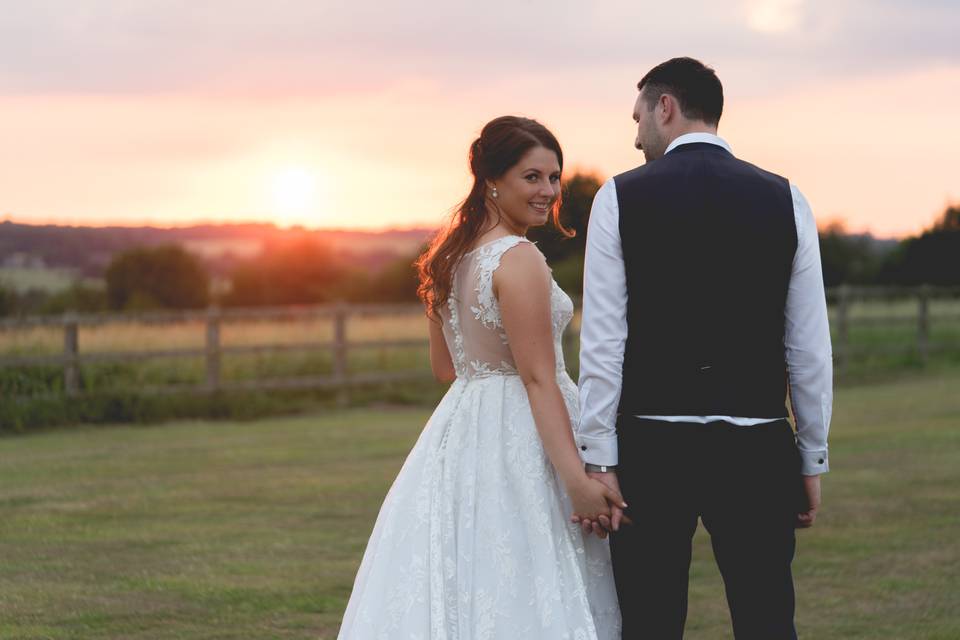 Holding hands by sunset