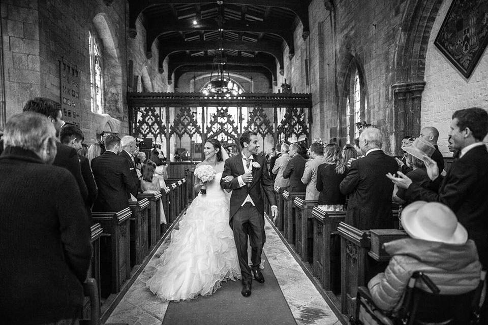 Bride and groom exit church