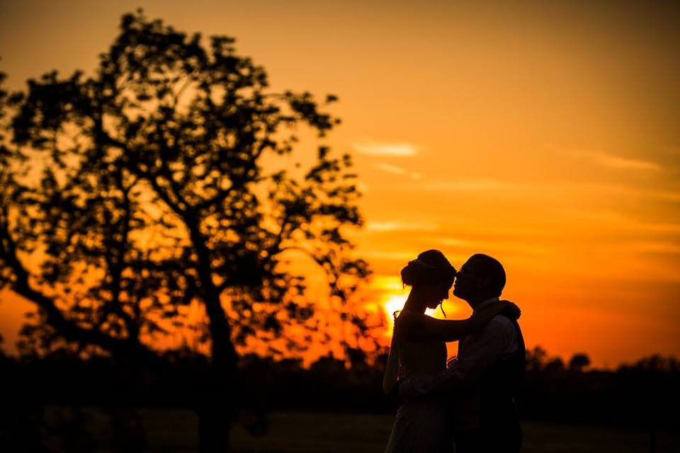 Sunset with bride and groom