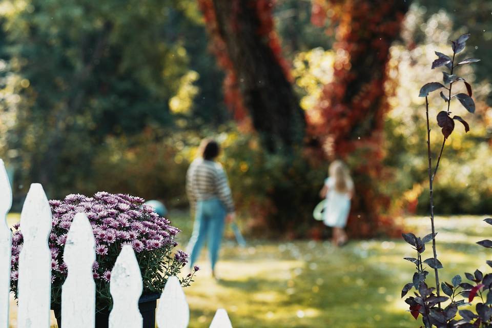 Girls at play beneath autumn