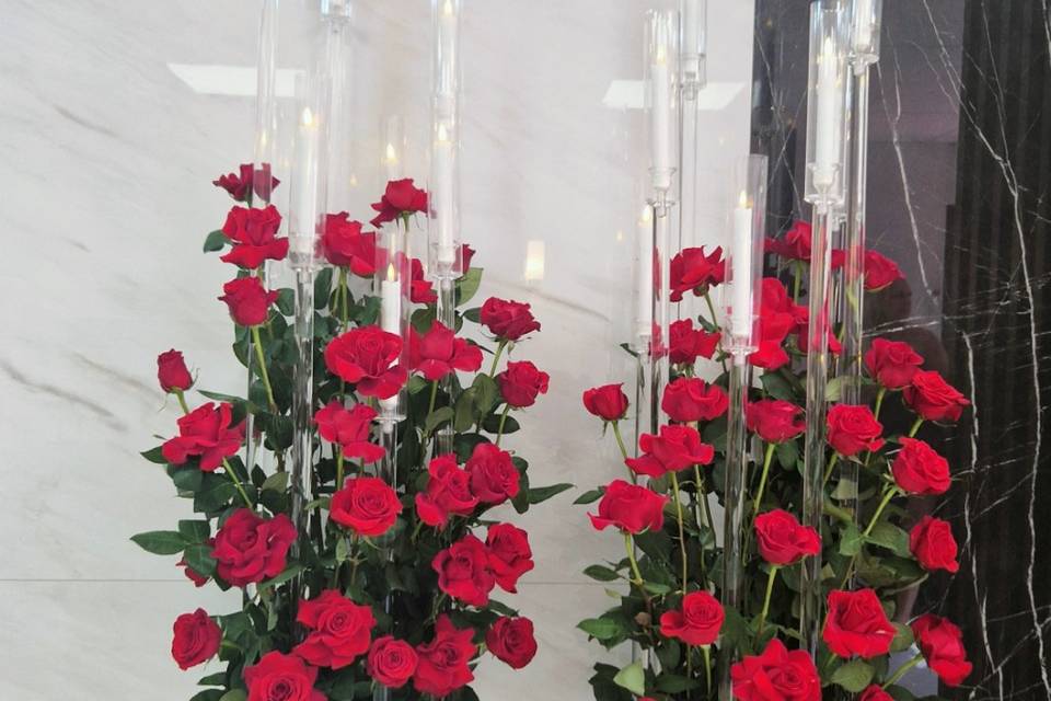 High candelabra with red roses