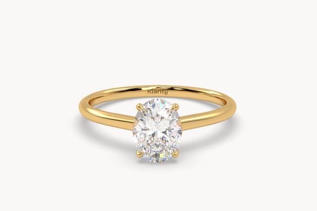 Oval solitaire engagement ring in yellow gold